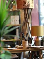 Workspace with modern decor and indoor plants in cozy environment photo