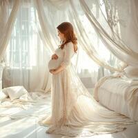 Elegant maternity portrait in a soft, dreamy bedroom setting photo