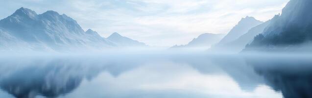 Mystical fog envelops serene mountains and calm waters at dawn photo