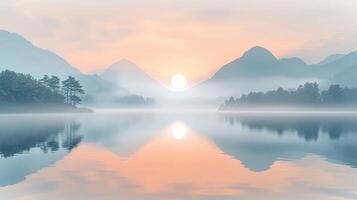 Fog envelops tranquil lake and mountains during sunrise photo