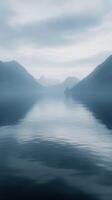 A lake with mountains in the distance photo