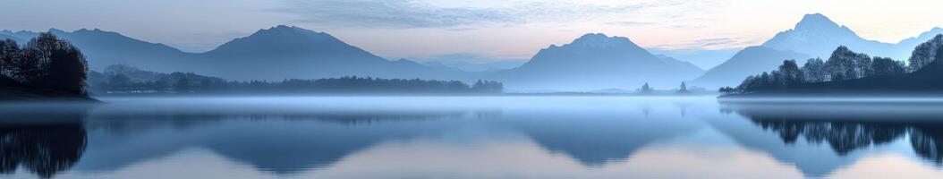 A lake surrounded by mountains and trees photo