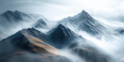A mountain range is covered in fog photo