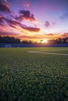 Sunset over stadium turf at a local sports field during evening photo