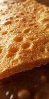 A piece of cheese on a table photo