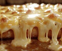 A close up of a pizza with melted cheese photo
