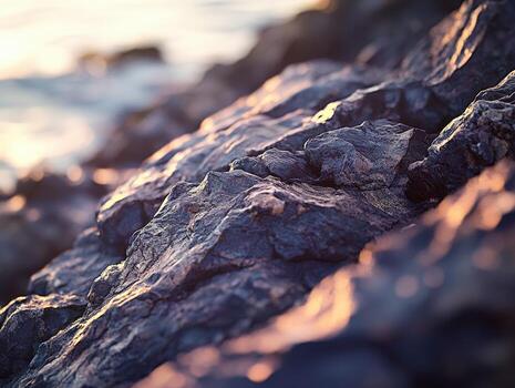 Cliffs in golden sunlight at shoreline photo