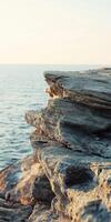 Coastal cliff overlooking water photo