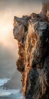 Sunset glow on rugged cliffside photo