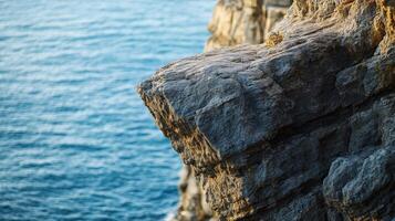 A person standing on the edge of a cliff photo