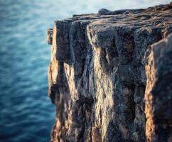 Rocky cliff by the ocean photo