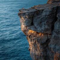 A cliff with a light shining on it photo