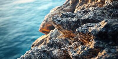 A close up of rocks on the side of a cliff photo