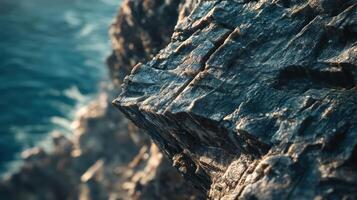 Close-up of textured rock near water photo