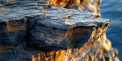 Textured rock formation by water photo