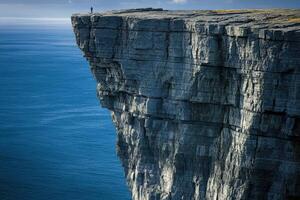 Standing on the cliff edge photo