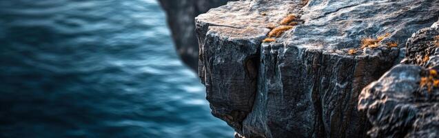 Rocky cliff near ocean waves photo