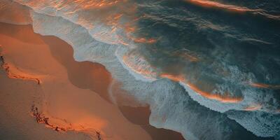 Sunset waves on a sandy beach photo