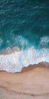 Waves lapping at sandy shore photo