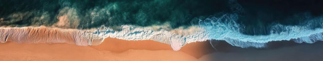 Waves crash on sandy beach photo