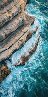 The rocky coast of the sea in the middle of the ocean photo