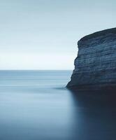 Coastal cliff at dusk photo