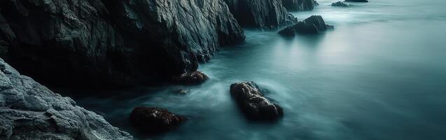 Serene coastal rocks at dusk photo