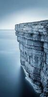 Cliffside view over calm waters photo