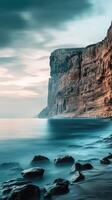 Coastal cliffs under a cloudy sky photo