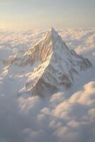 A mountain is seen above the clouds in this image photo