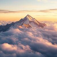 Mountain peak above clouds photo