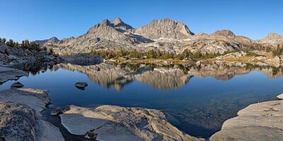 Scenic mountain reflection at dawn photo