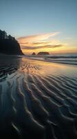 Sunset reflections over coastal beach photo