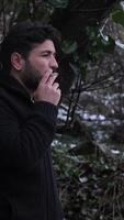 Man Smoking in Snowy Weather video