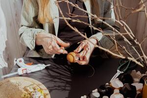 Tutorial How to make Easter table decoration with egg shells step by step instruction. Easter home decoration on wooden branch. Seasonal sustainable recycled decor photo