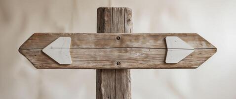 Rustic wooden signpost with two blank directional arrows. photo