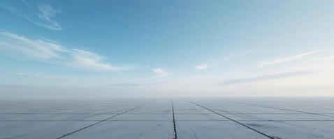 An empty concrete floor with sky in the background photo