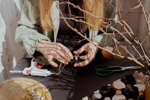 Unrecognizable woman creating Easter holiday decoration from egg shell. Diy do it yourself step by step instruction. Crafting preparation holiday photo