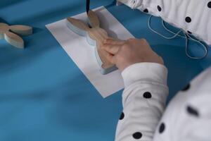 Creating Easter rabbit bunny with cotton rope Storytelling of creating craft Easter greeting card holiday present. Tactile hand-on activity. Master class progress of creative me-made gifts. Seasonal domestic life micro moment hobby. Sustainable living photo