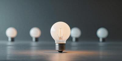 Illuminated white bulb set apart from the others. photo