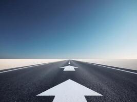 An empty road with two arrows pointing in different directions photo