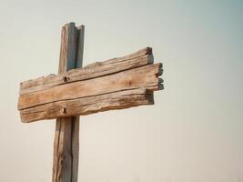 Rustic wooden signpost with empty space for directional text. photo
