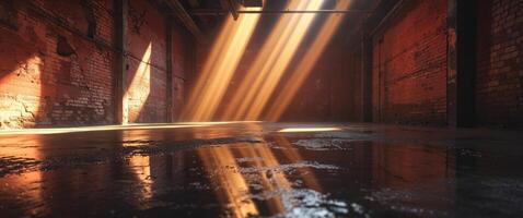An empty warehouse with sunlight shining through the windows photo