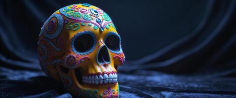 A decorated colorful skull is showcased in a dark setting photo