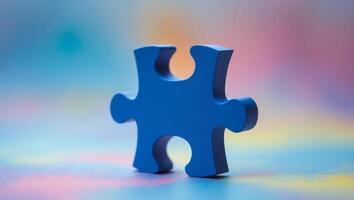 Single blue puzzle piece representing uniqueness on softly blurred multicolored background. photo