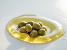 Olives in oil on white background photo