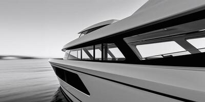 Modern boat design showcasing sleek lines and large windows cut out. photo