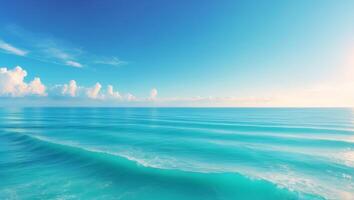 A beautiful blue ocean with waves and clouds photo