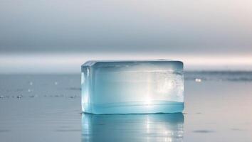 A large ice block sits on the surface of the water. photo