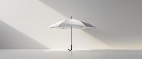 An umbrella is standing in front of a white wall photo